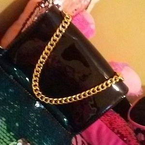 Black glossy leather purse